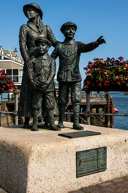 A statue of Annie Moore and her two brothers